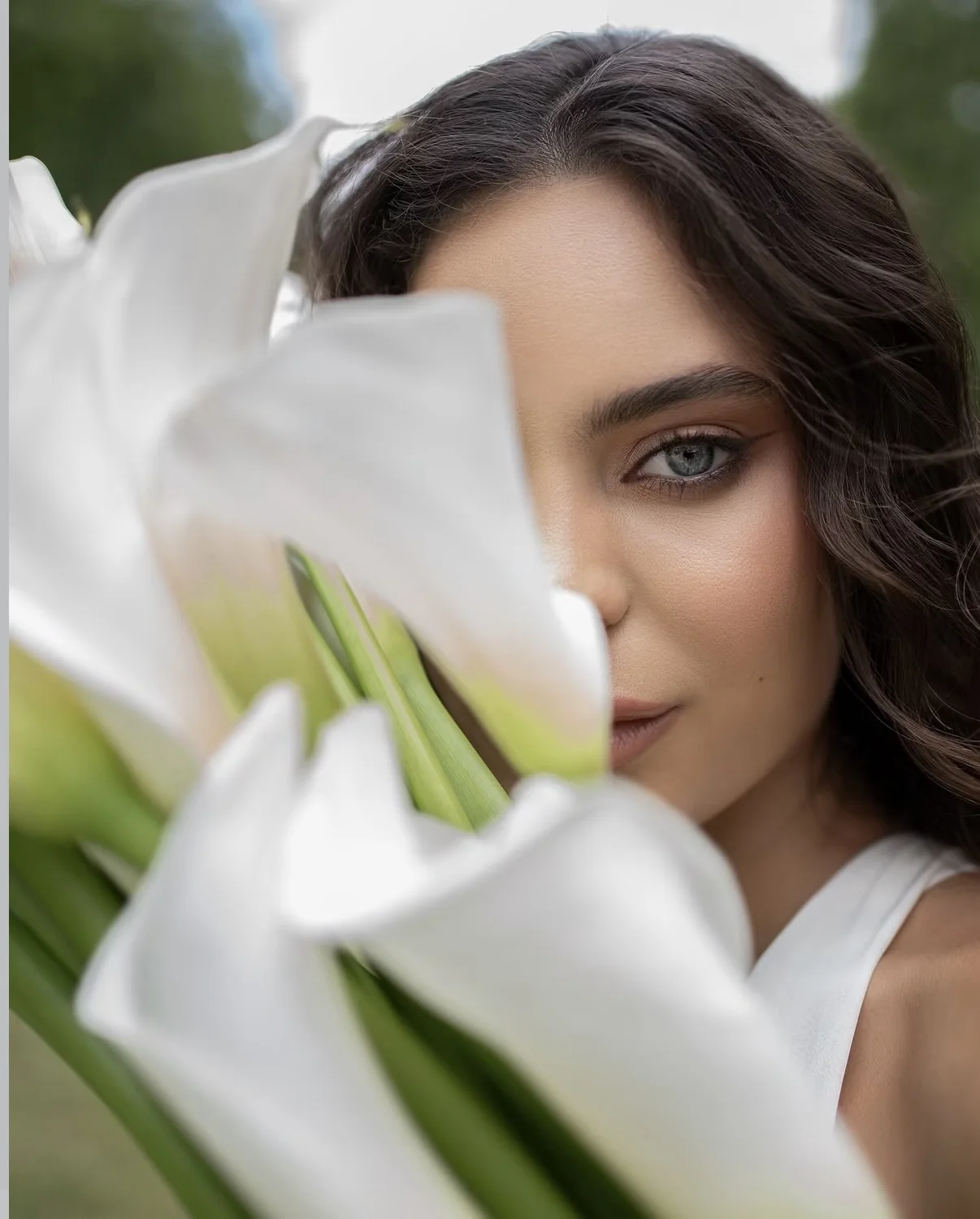 Beauty portrait framed with white calla lilies