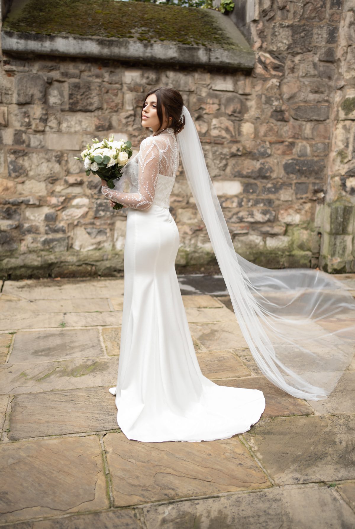 Bridal portrait with a veil, photographed in natural light