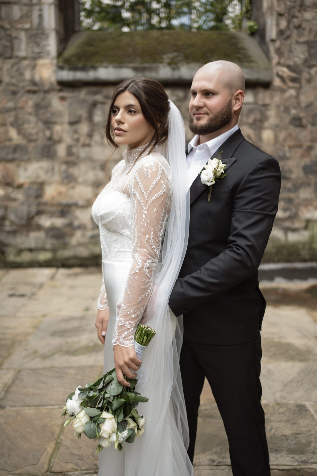 Wedding couple photographed outside a church